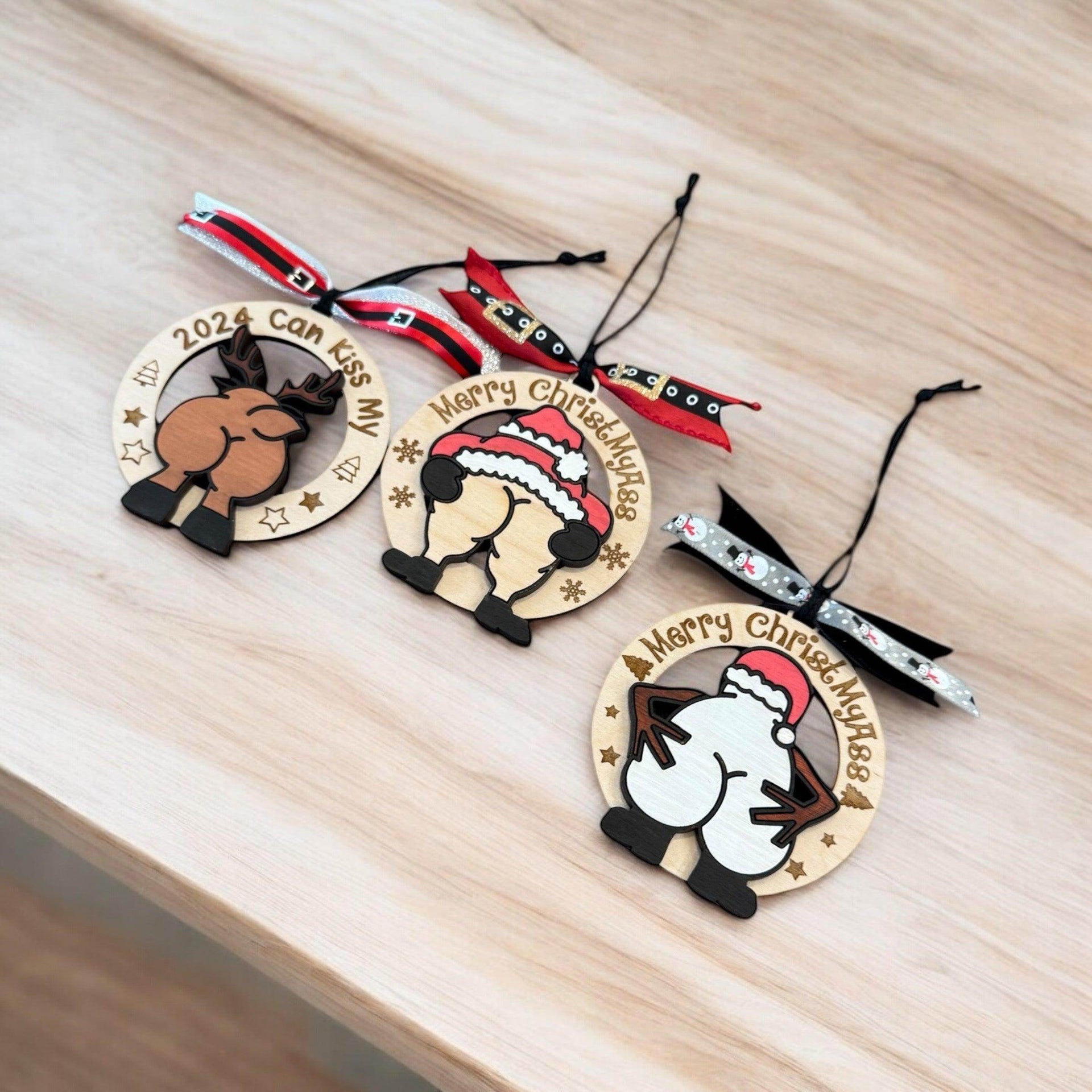 Humorous Wooden Christmas Ornaments - “Merry ChristMyA” and “2024 Can Kiss” - Funny Holiday Decor - Coastal Chaos LLC