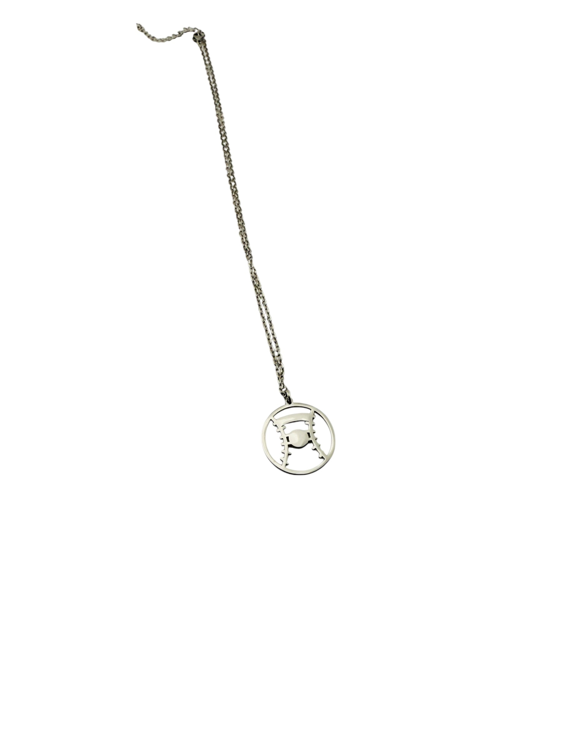 A silver necklace with a circular pendant featuring a baseball design.