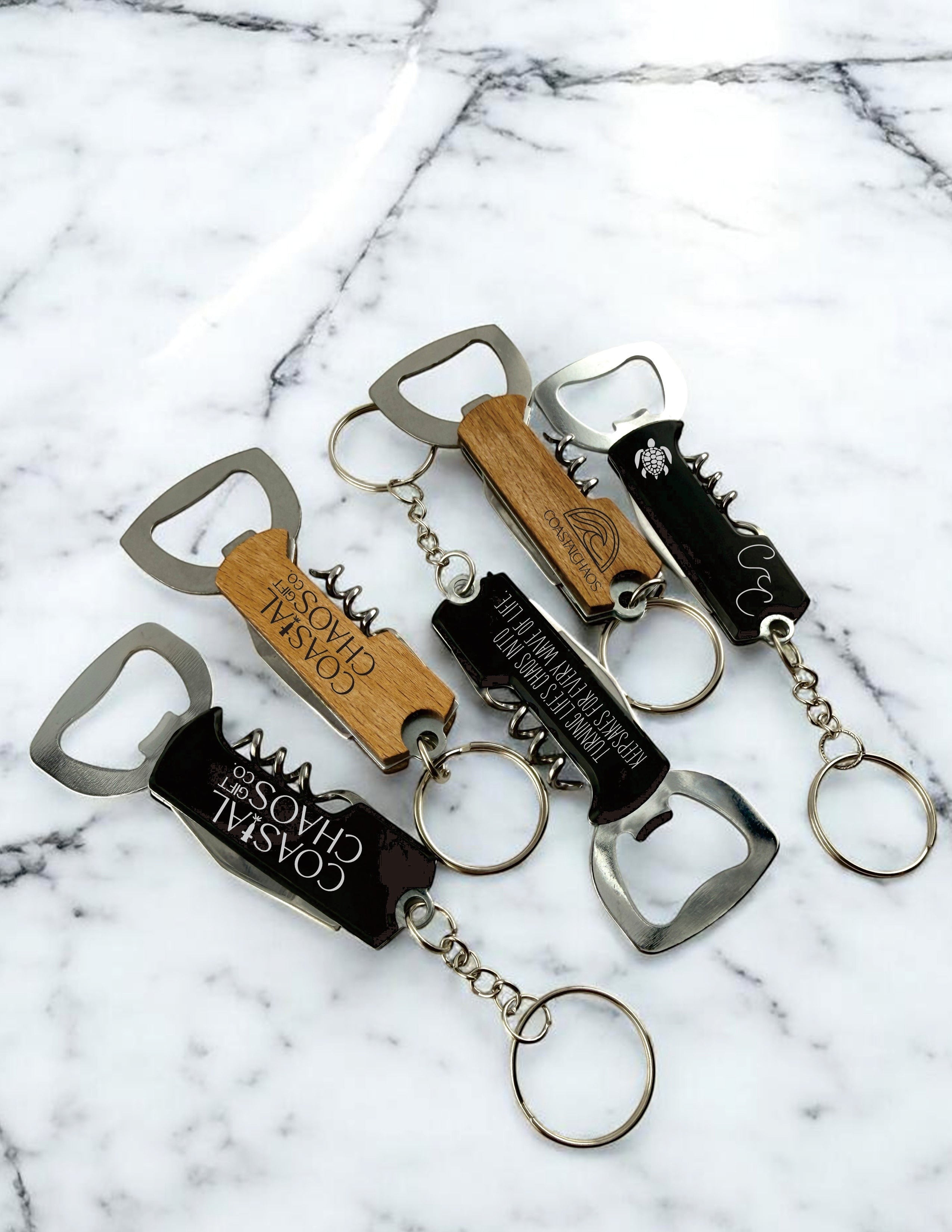 Coastal Chaos Co. custom engraved corkscrew bottle opener keychains in wood and black finishes. Multi-tool gifts.