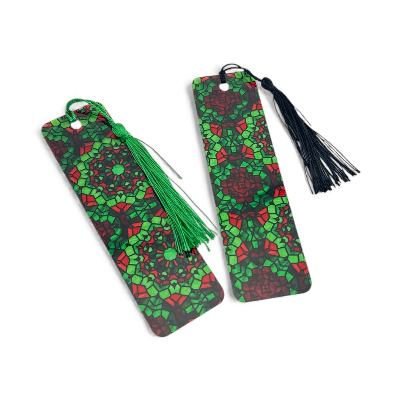 two green and red patterned bookmarks with tassels.