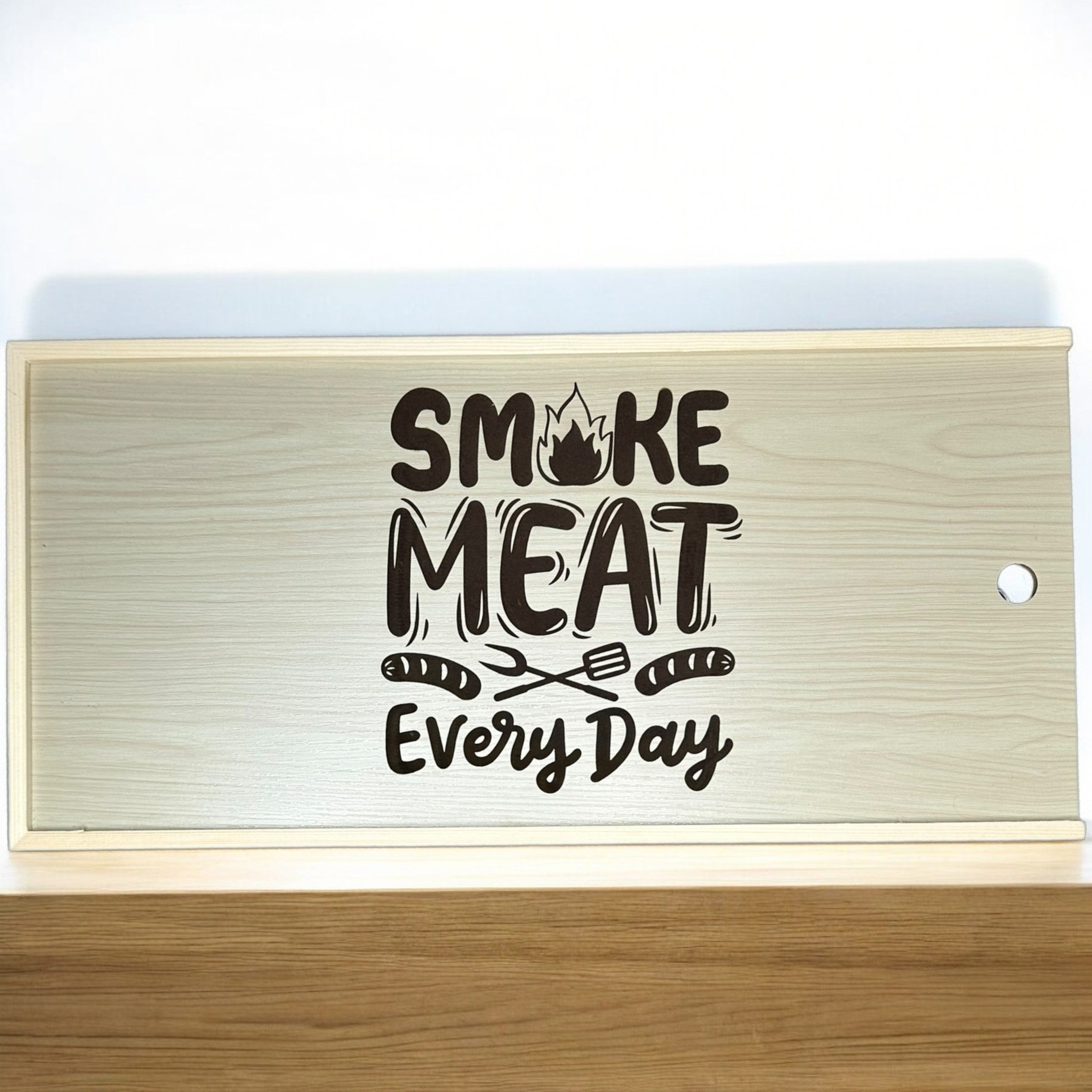 a wooden cutting board with a black and white text design on it.