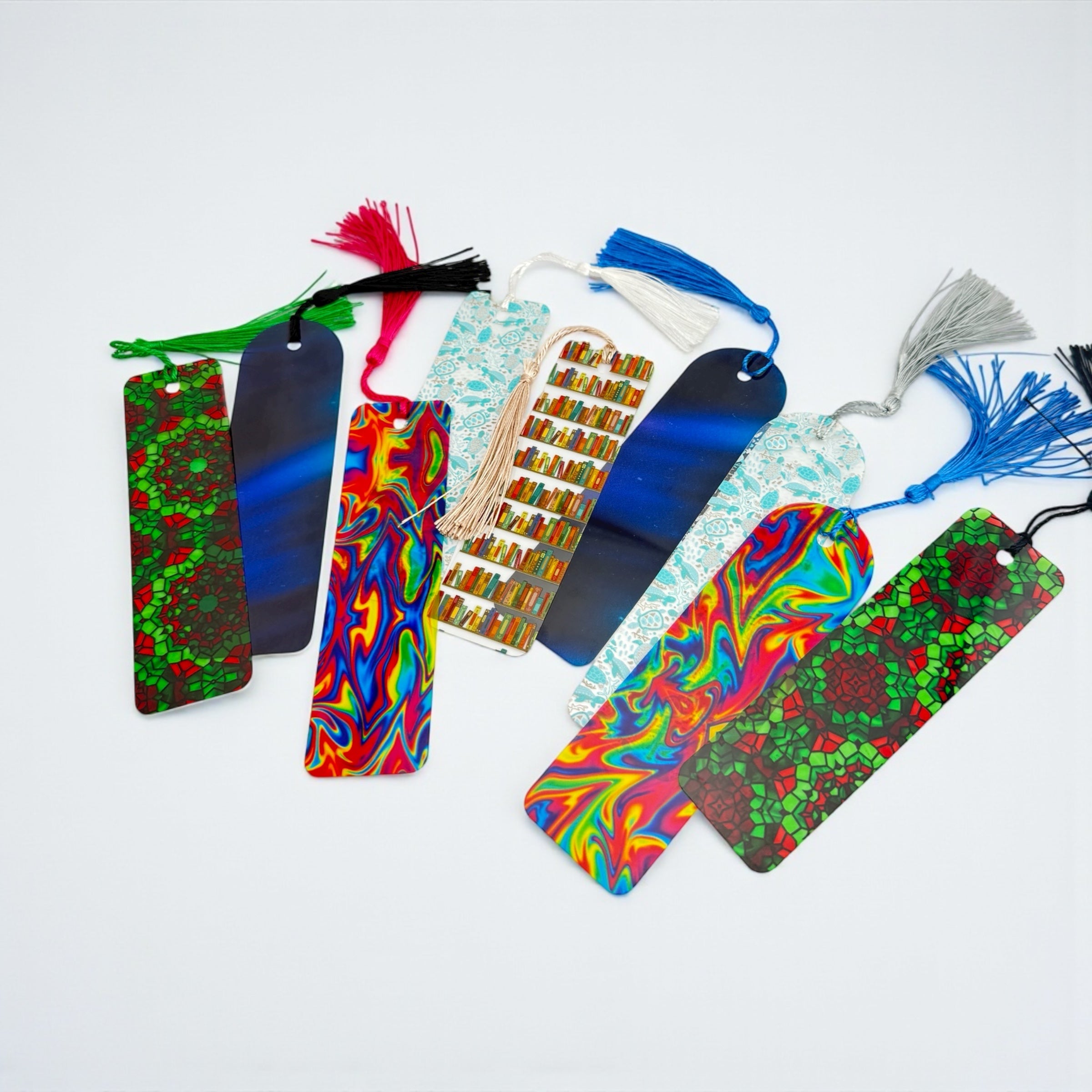 A collection of colorful and patterned bookmarks arranged on a white background.
