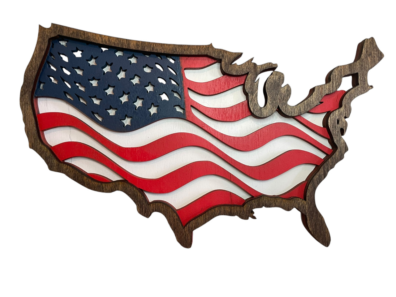 The image is a wooden cutout of the United States of America, featuring the American flag as the central design element.