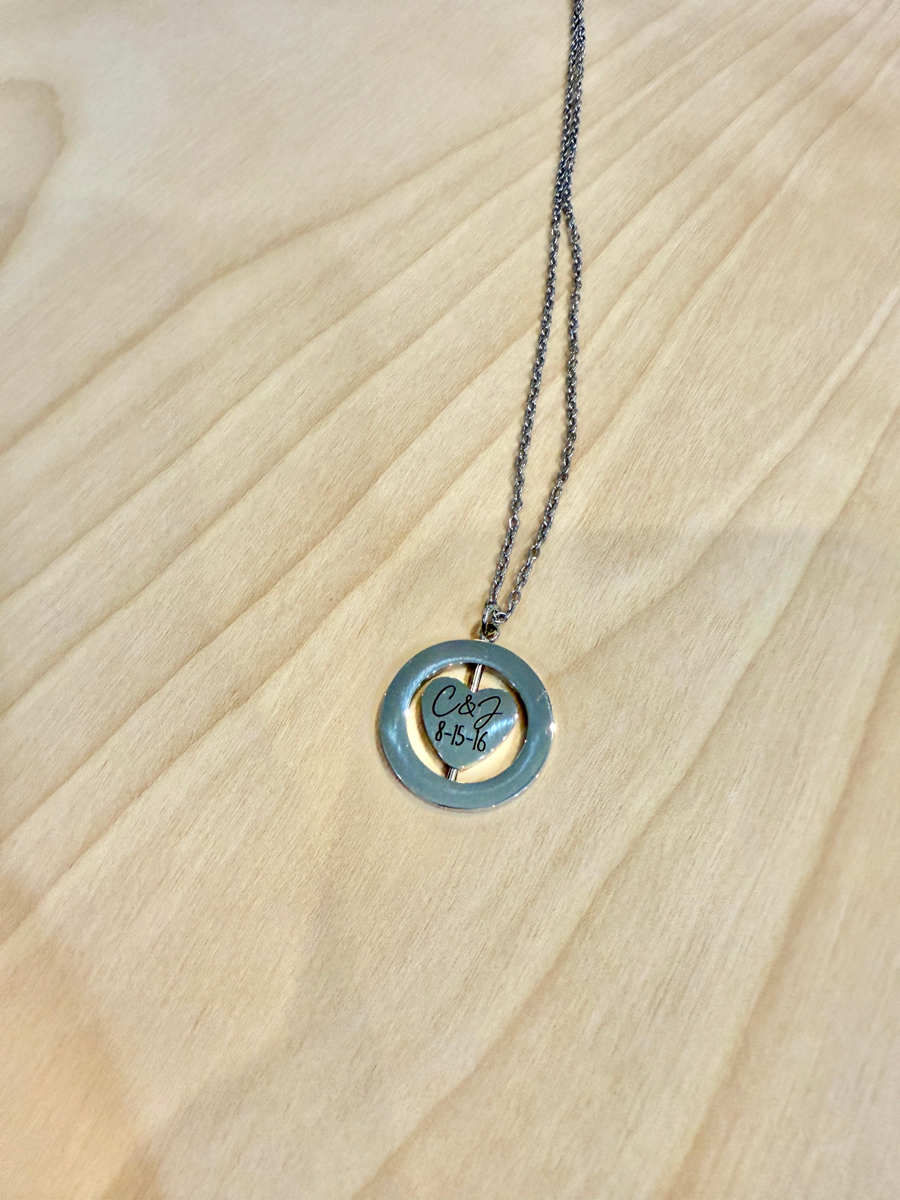 Necklace with a round pendant on a wooden surface