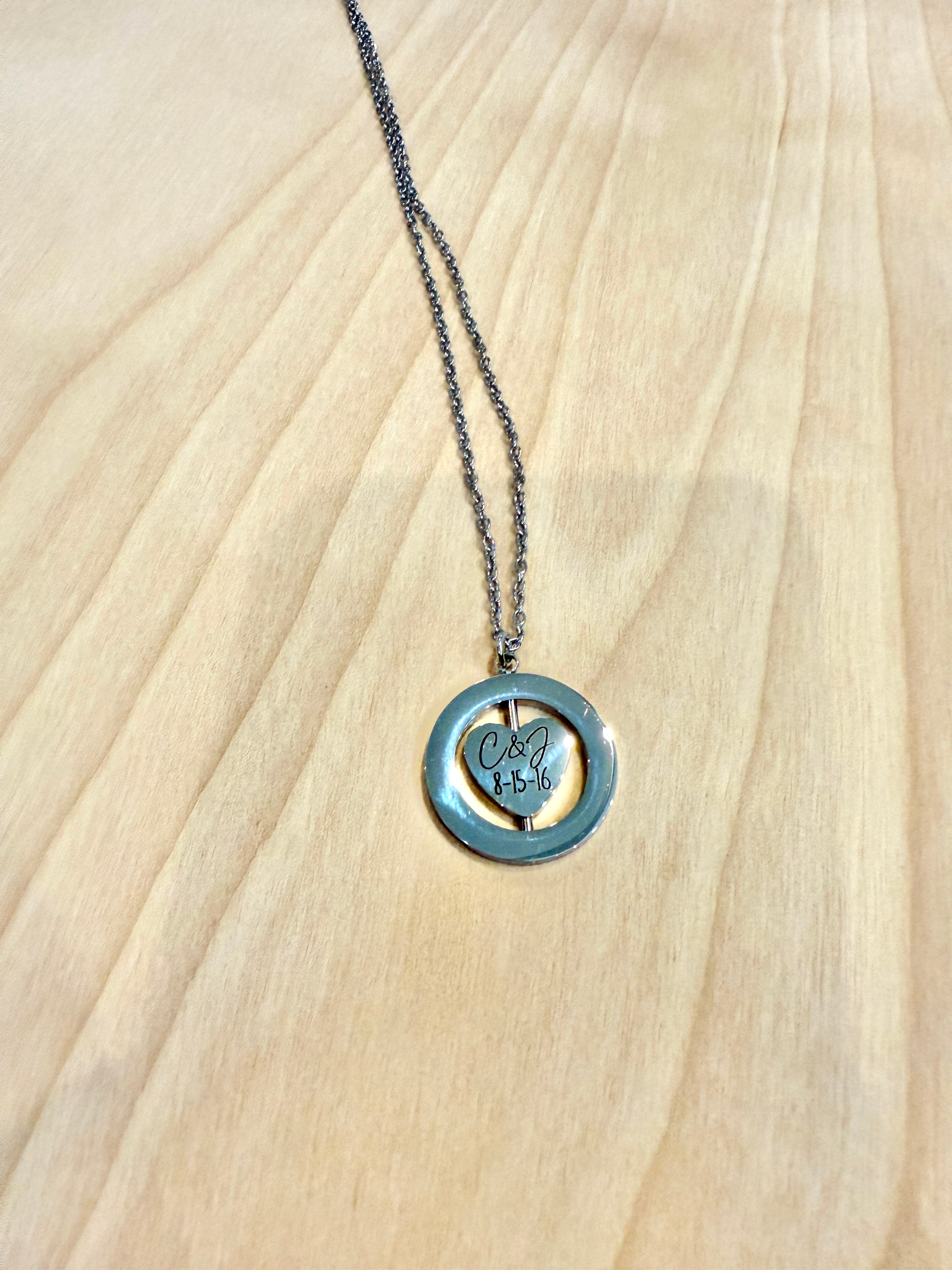 Necklace with a heart-shaped pendant on a wooden surface