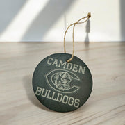 A round, dark grey ornament with the text "CAMDEN BULLDOGS" printed on it, hanging from a string.