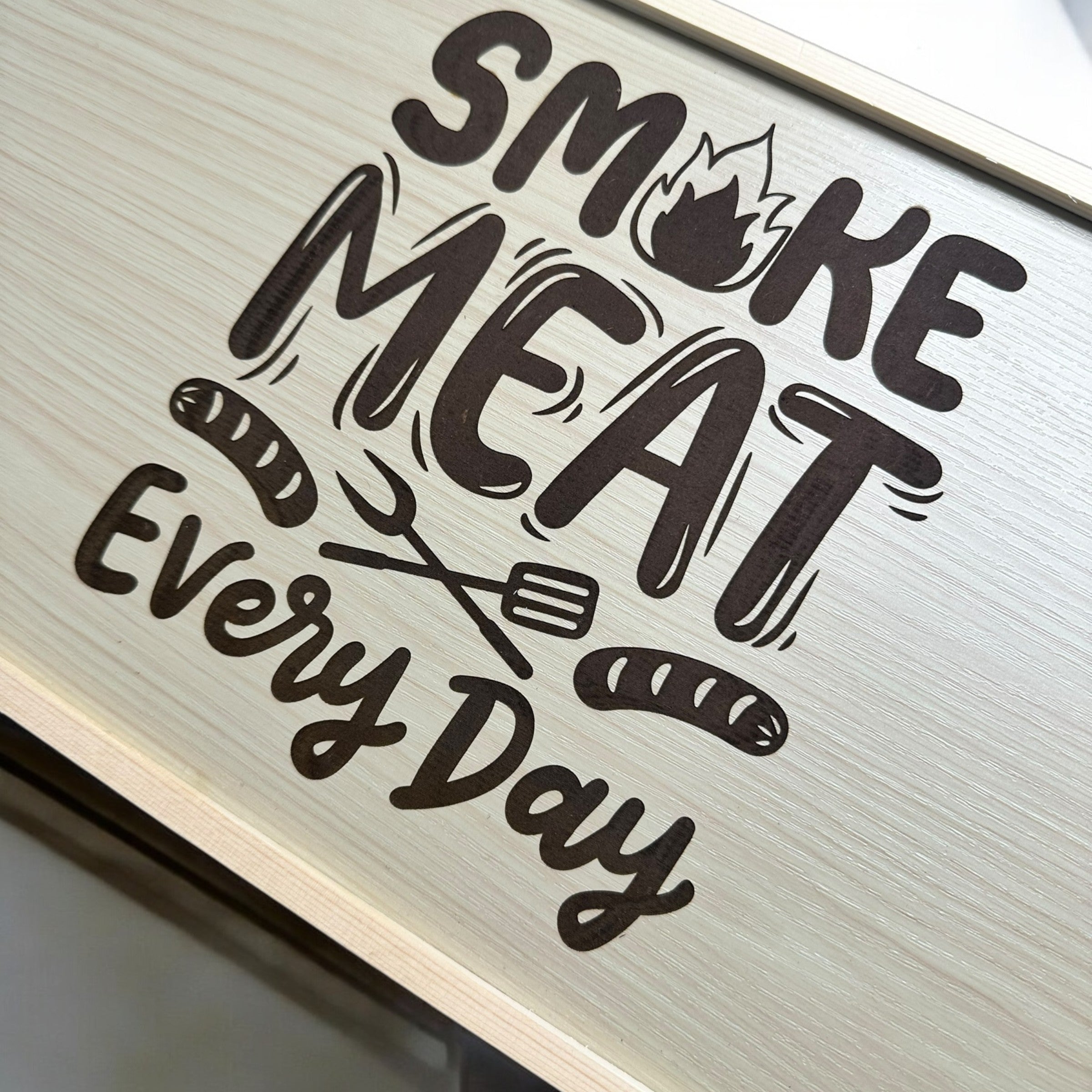 a sign with the text "Smoke Meat Every Day" in a stylized font.